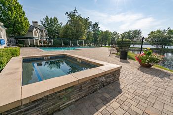 Pool area with spa and paver patio